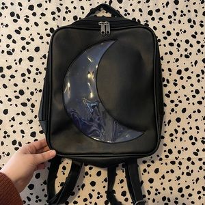 black crescent moon backpack